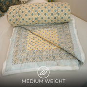 Elegant Floral Block Printed Quilt in Blue and Beige