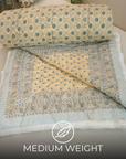 Elegant Floral Block Printed Quilt in Blue and Beige