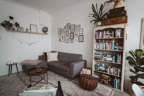 Gray sectional sofa in cozy living room with unique throw pillows for a stylish transformation.